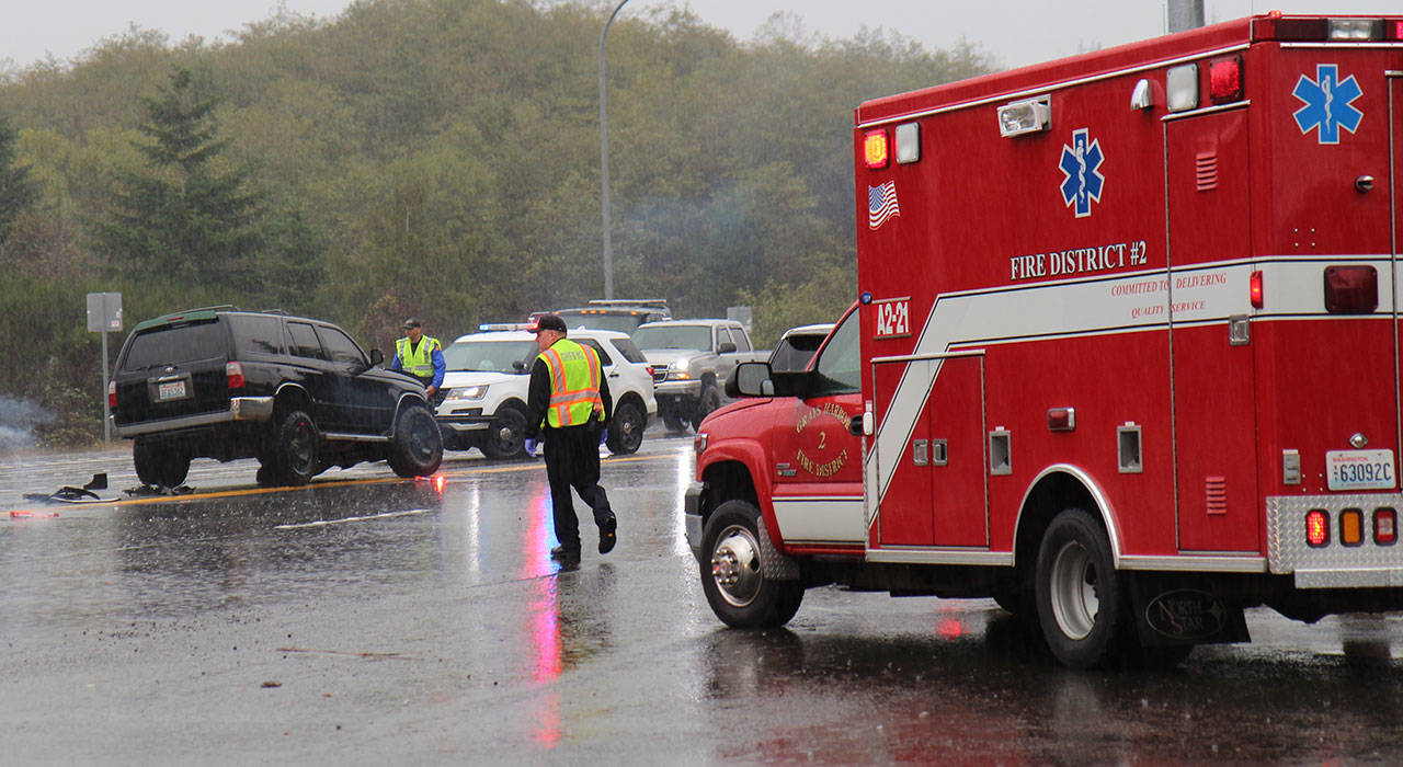 Two vehicles, including this black Toyota 4Runner (left), collided Thursday, Oct. 3, 2019, west of Montesano at the intersection of Clemons Road and U.S. Highway 12. Multiple agencies responded to the scene. One person was reported as injured, but additional information was not available Thursday afternoon. (Michael Lang | Grays Harbor News Group)