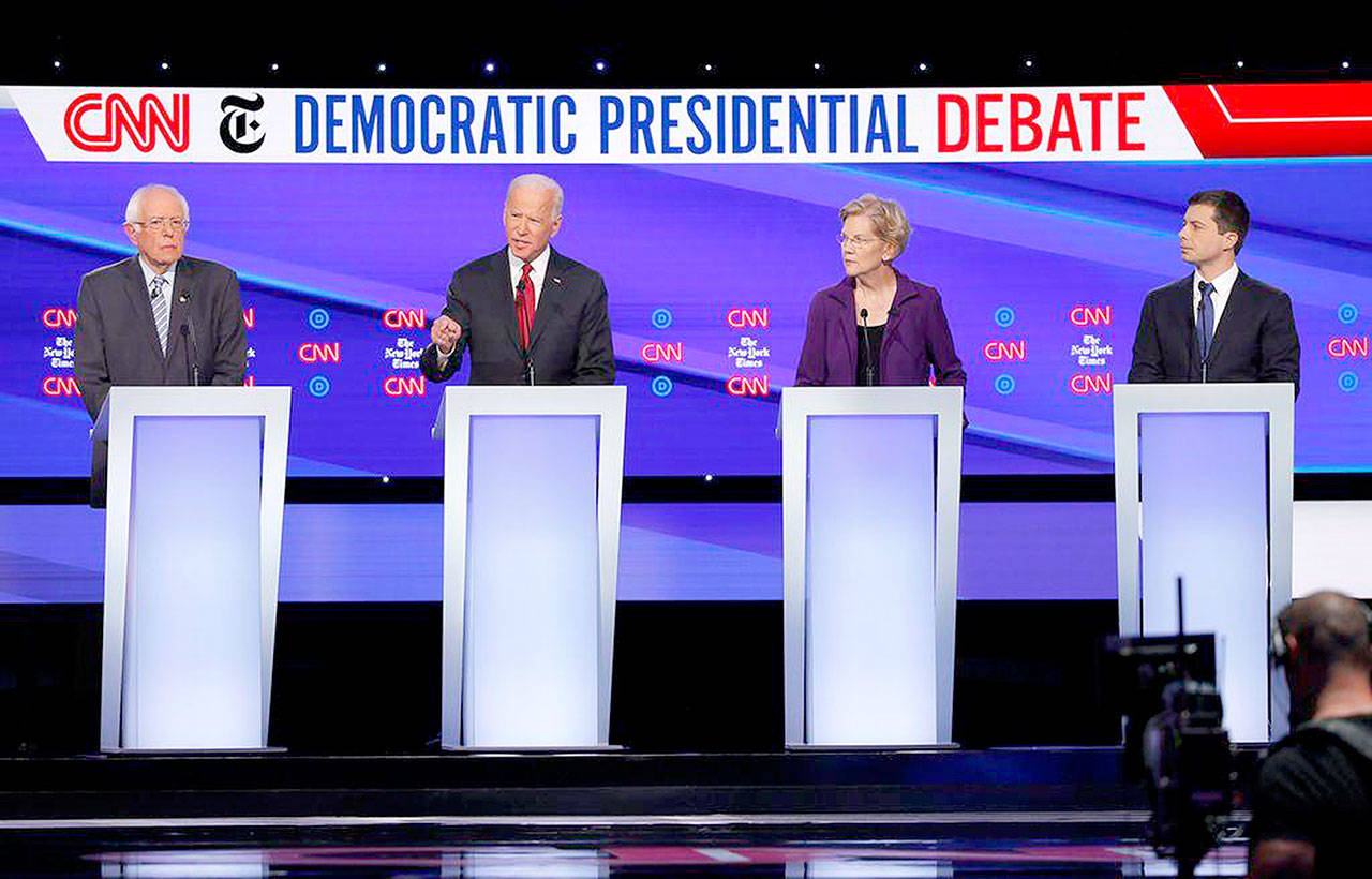 From left, Sen. Bernie Sanders (I-Vt.), former Vice President Joe Biden, Sen. Elizabeth Warren (D-Mass.), South Bend, Ind. Mayor Pete Buttigieg during the Democratic Presidential Debate at Otterbein University in Westerville, Ohio, on Tuesday. (Adam Cairns/Columbus Dispatch)