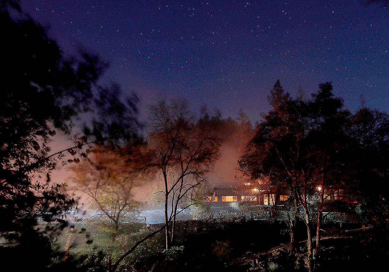 A house burns along Highway 183 near the head of the Kincade fire in Sonoma County, Calif., on Tuesday. (Luis Sinco/Los Angeles Times)