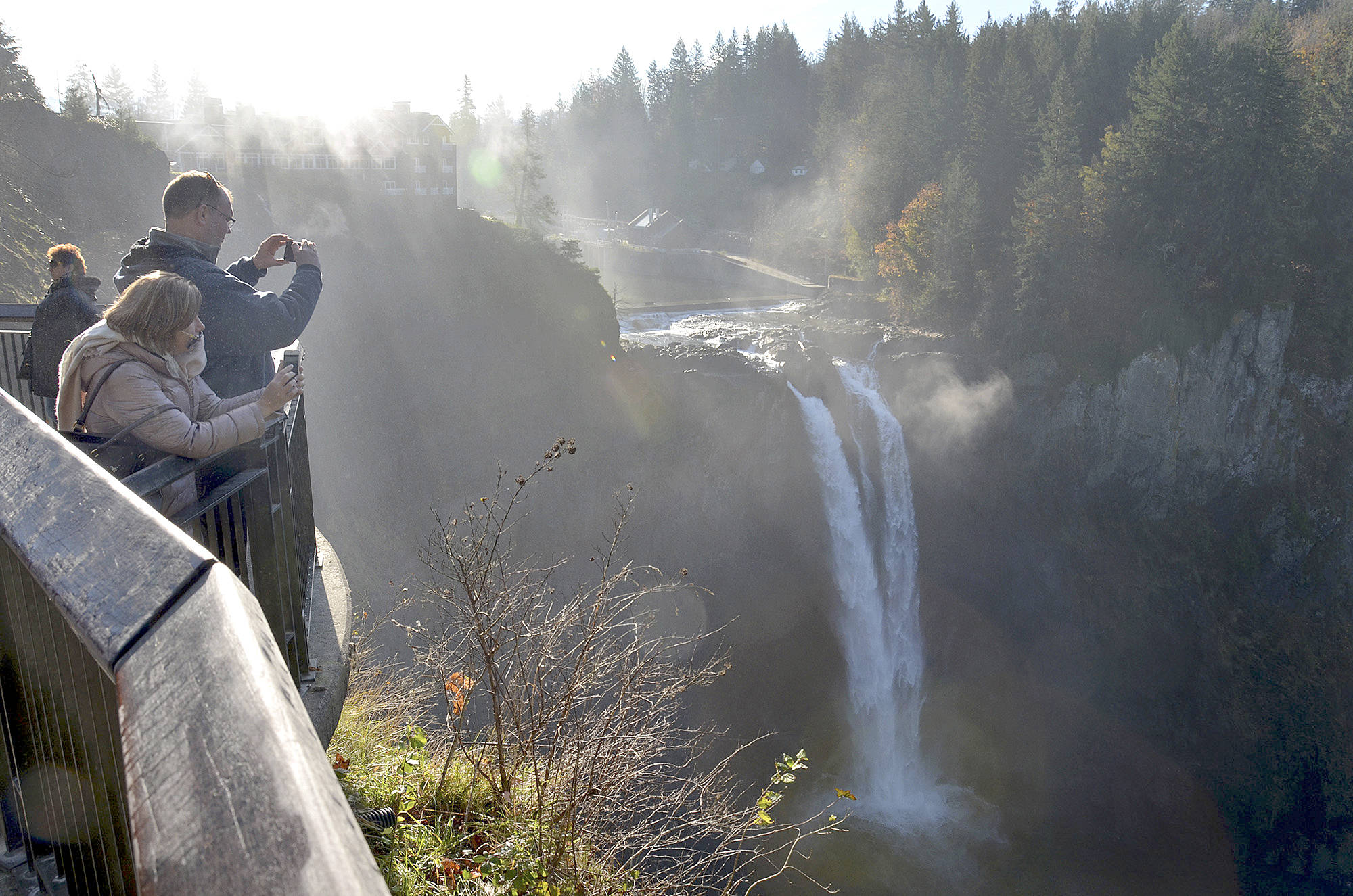 Richard Read/Los Angeles Times                                 Visitors photograph Snoqualmie Falls, a 270-foot-high waterfall east of Seattle where tribal leaders announced a deal on Friday to block development of the surrounding land, considered sacred by the tribe.