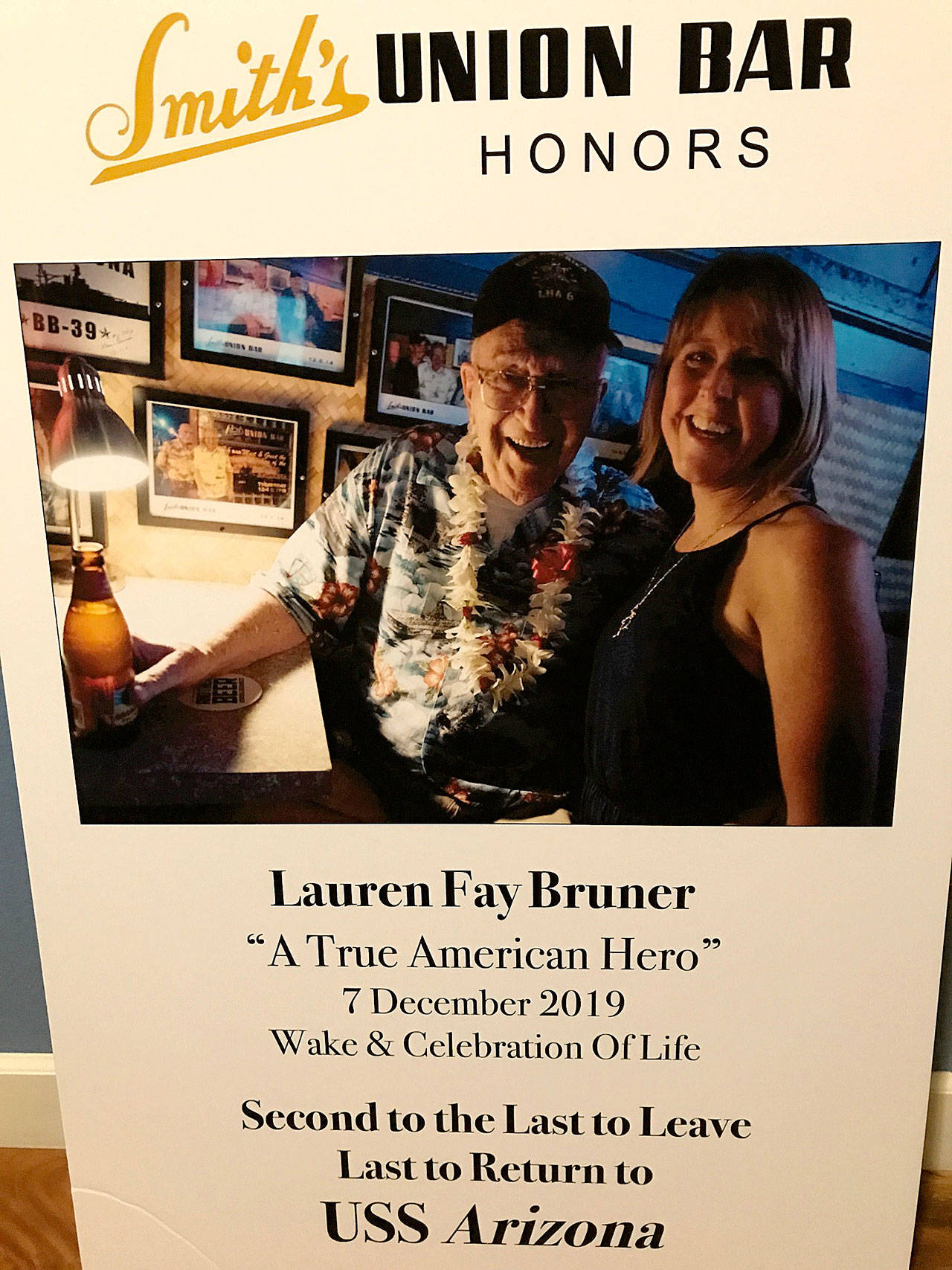 Photo courtesy Teri Mann Whyatt                                A sign at Smith’s Union Bar in Honolulu includes a picture of Lauren Bruner and Teri Mann Whyatt when they met in 2016.