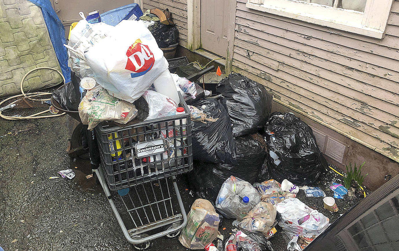 COURTESY HOQUIAM POLICE DEPARTMENT                                 Trash piled up alongside a property in the 300 block of Eklund Avenue condemned by the City of Hoquiam on Jan. 28.