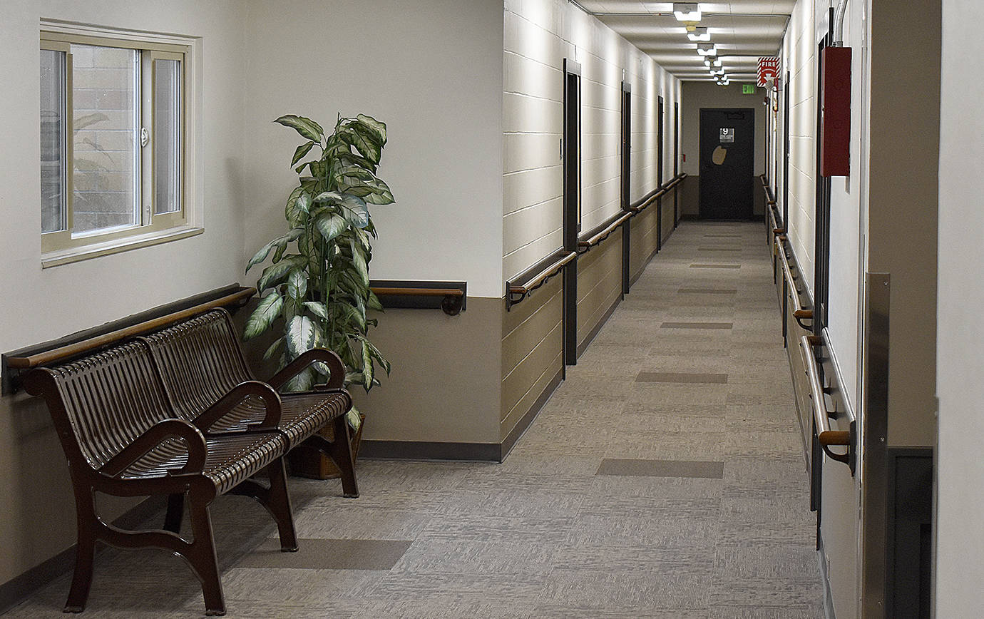 DAN HAMMOCK | GRAYS HARBOR NEWS GROUP                                 The walls of his hallway at Aberdeen Manor used to be all white. New flooring, a new two-tone paint job and energy efficient motion activated lighting are among the upgrades recently completed.