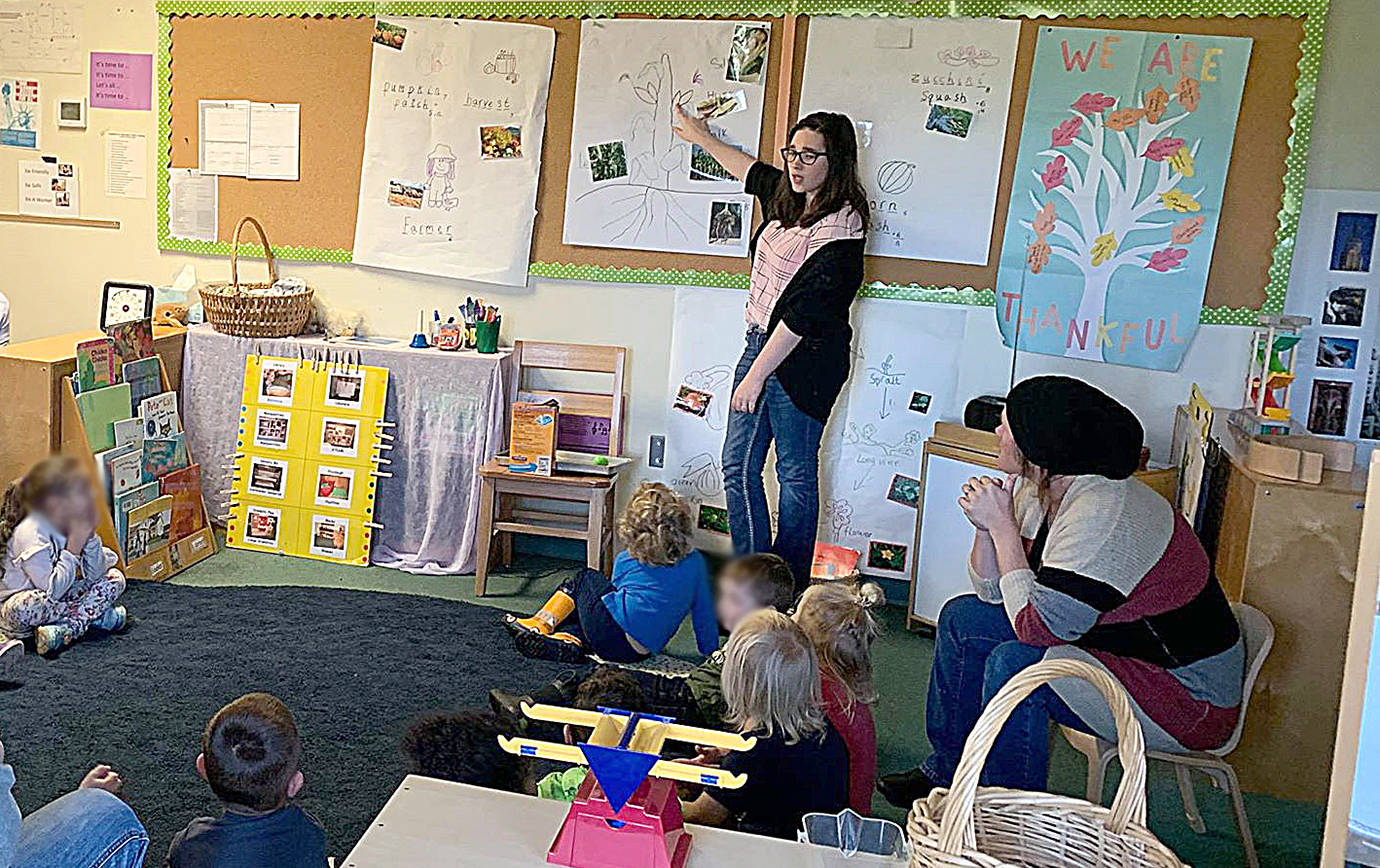 COURTESY LEARNING TO GROW                                 Kourtnie Mueller is leading a literacy activity in Learning to Grow’s pre-kindergarten class. The class is a creative blend of private pay child care, Working Connections state subsidy care and ECEAP state-assisted preschool.