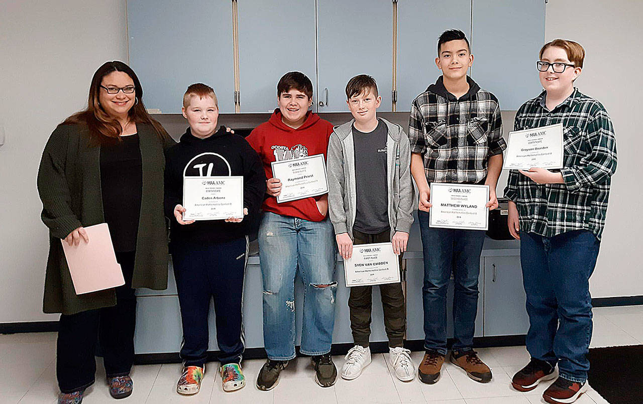 COURTESY OCOSTA SCHOOL DISTRICT                                 Five Ocosta School District students were honored this month for high scores on the Mathematical Association of America’s AMC-8 test. From left, coach Brook Priest, Caden Arbona, Raymond Priest, Syen Van Embden, Matthew Wyland and Grayson Bearden.