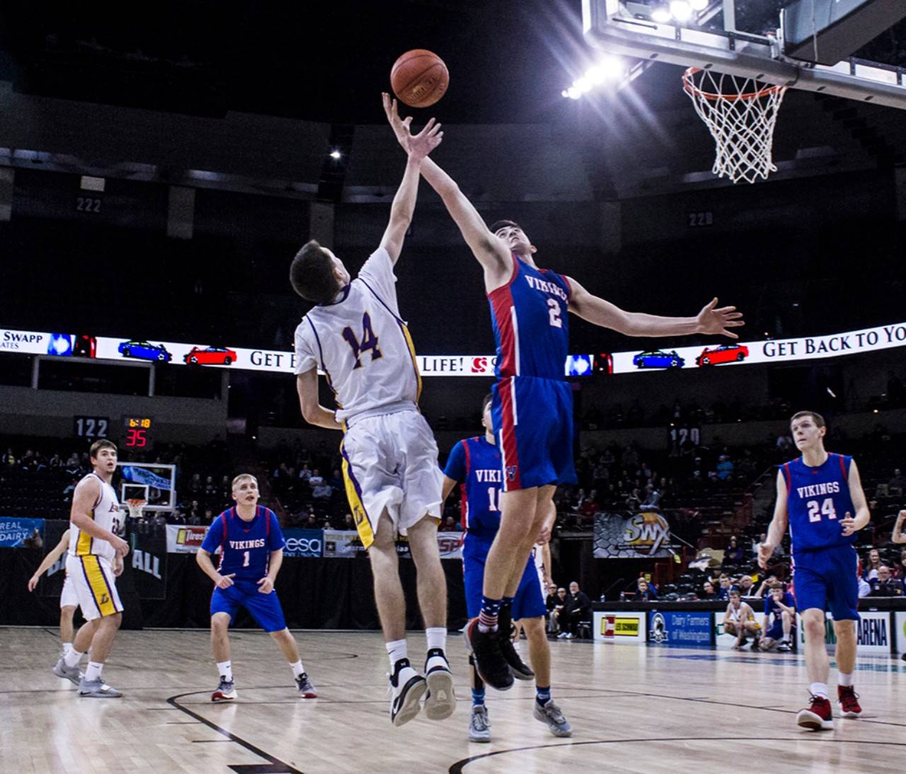 Willapa Valley’s Logan Walker (2) goes for a rebound against Liberty’s Mason Simmons during the Vikings’ 71-62 victory in a 2B State Tournament quarterfinal game on Thursday at the Veteran’s Memorial Arena in Spokane. Walker led all scorers with 30 points. (Brandon Hansen | Chewelah Independent)