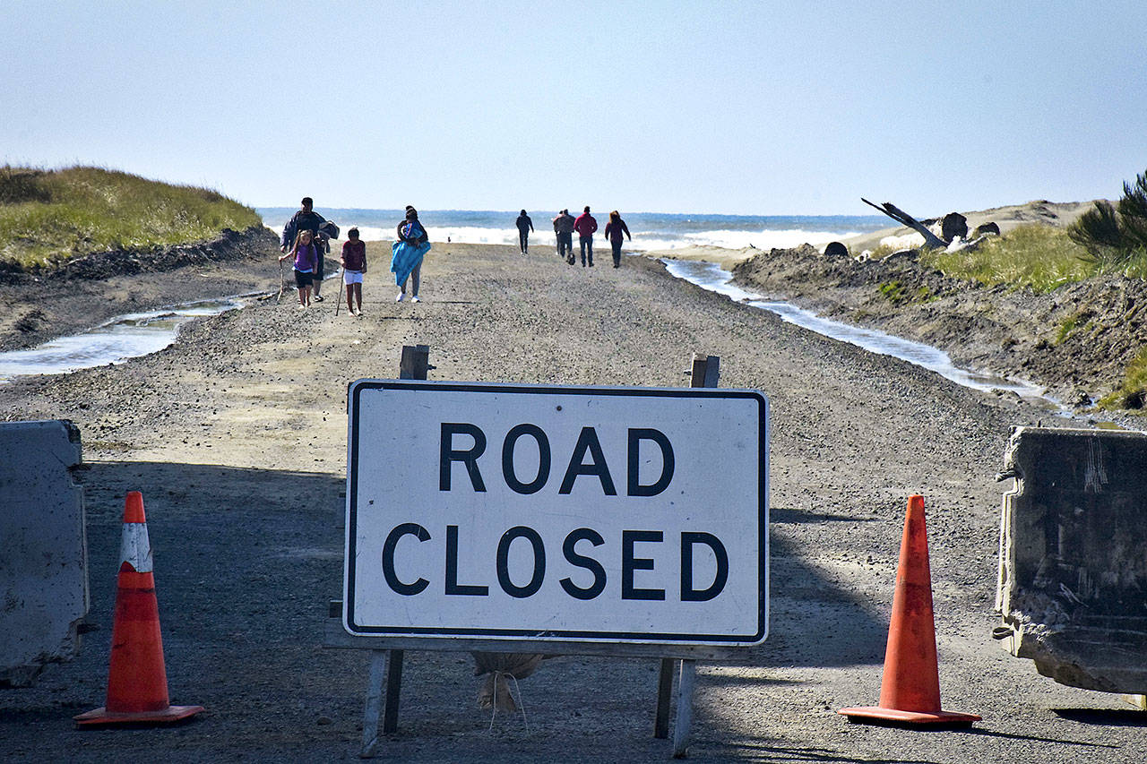 Walkers use the Damon Road beach approach just north of the Ocean Shores city limits on Saturday afternoon, when 10 cars were parked nearby. (Photo by Scott D. Johnston)