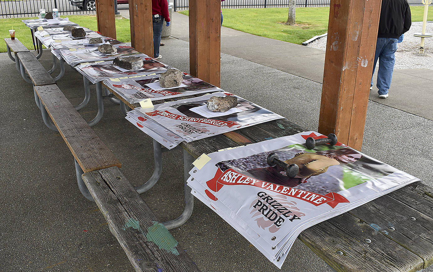 DAN HAMMOCK | GRAYS HARBOR NEWS GROUP                                 An anonymous donor paid for 123 banners honoring Hoquiam High School’s Class of 2020. Seniors practiced social distancing and posed for photos with their banners at Art Pocklington Central Play Park Monday.