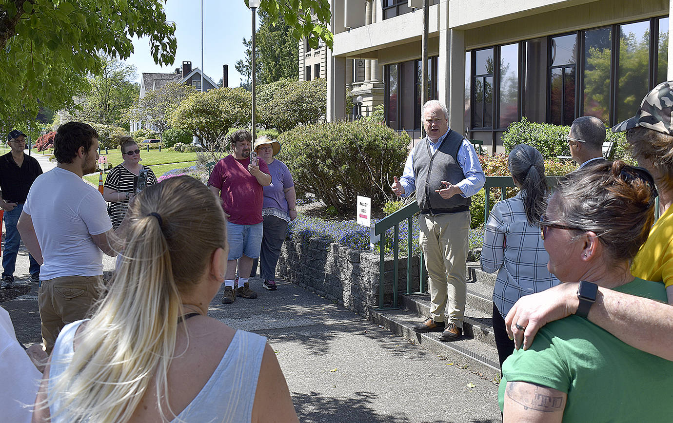 DAN HAMMOCK | GRAYS HARBOR NEWS GROUP                                 Rep. Jim Walsh, R-Aberdeen, speaks to a group of about 25 people at a rally in Montesano Friday supporting the reopening of the county. Also speaking was Joel McEntire, R-Cathlamet, who is challenging incumbent Rep. Brian Blake, D-Aberdeen, for his 19th District seat. The two fielded questions about the governor’s emergency orders and urged a common sense approach to reopening the economy.