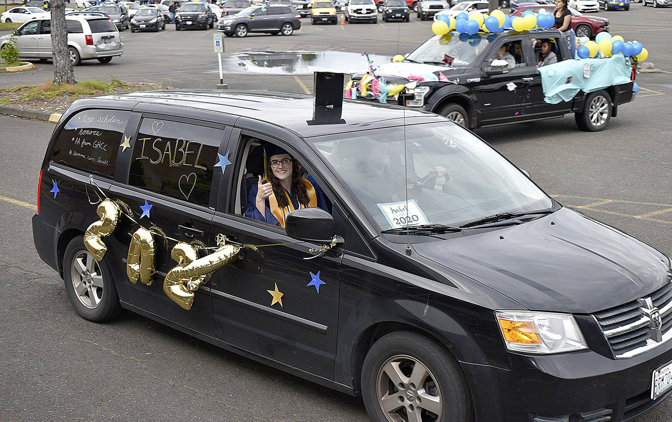 Aberdeen High School Class of 2020 Top Scholar Isabel Rifenberg waves as she and her family depart the Shoppes at Riverside at the beginning of the graduation parade Friday.