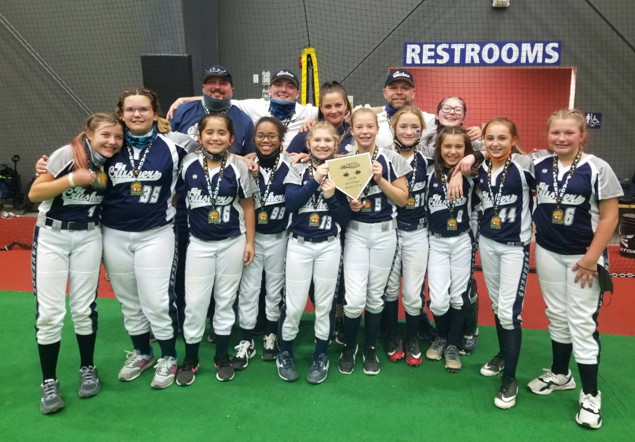 SUBMITTED PHOTO The Grays Harbor Crushers have gone 11-1 in winning two recent tournaments in Centralia. Pictured are (front row, left to right): Madeline Luce, Anika Hovis, Noelia Diaz, Adasia Jones, Audree Gaddis, Rylee Hendrickson, Victoria Bull, Kylie Wilson, Jordyn Wade and Alyssa Edmondson. Top row: Head coach Joe Edmondson, Coach Kevin Gardener, Head Coach Nikki Gaddis, Head Coach Ric Gaddis and Britten Neal.