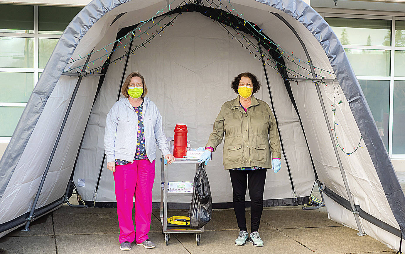 COURTESY GRAYS HARBOR COMMUNITY HOSPITAL 
Grays Harbor Community Hospital Chief Nursing Officer Melanie Brandt, left, and Employee Health-Infection Control Nurse Rosemary Chapman at the drive-through COVID-19 vaccination site at the hospital.