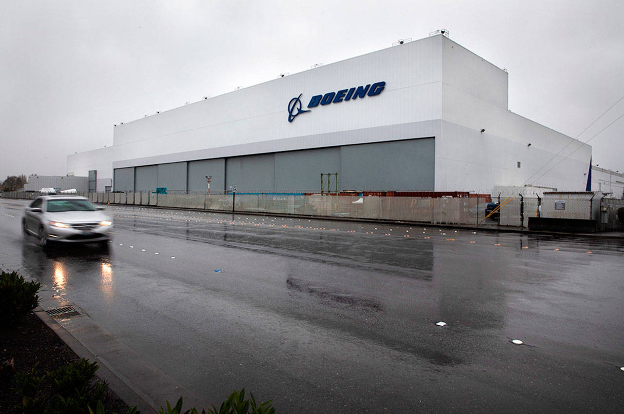 A car passes by Boeing’s Advanced Developmental Composites facility on East Marginal Way S. in Seattle on Tuesday, Jan. 5, 2020. The building has housed many secretive research projects. It was here Boeing perfected the manufacturing methods used to fabricate large parts of the B-2 Stealth bomber in the early 1990s and the wings of the 787 in the 2000s. Boeing now plans to close the facility. (Ellen M. Banner/Seattle Times/TNS)