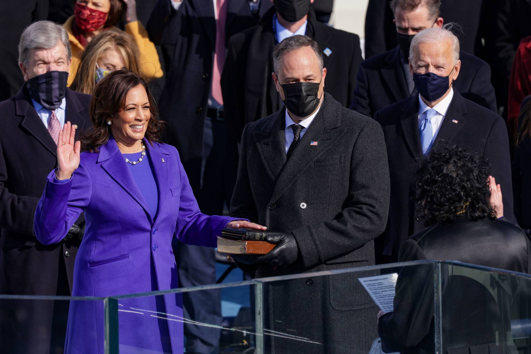 Alex Wong/Getty Images 
Kamala Harris is sworn in as vice president by U.S. Supreme Court Associate Justice Sonia Sotomayor as her husband Doug Emhoff looks on at the inauguration of U.S. President Joe Biden on Wednesday.