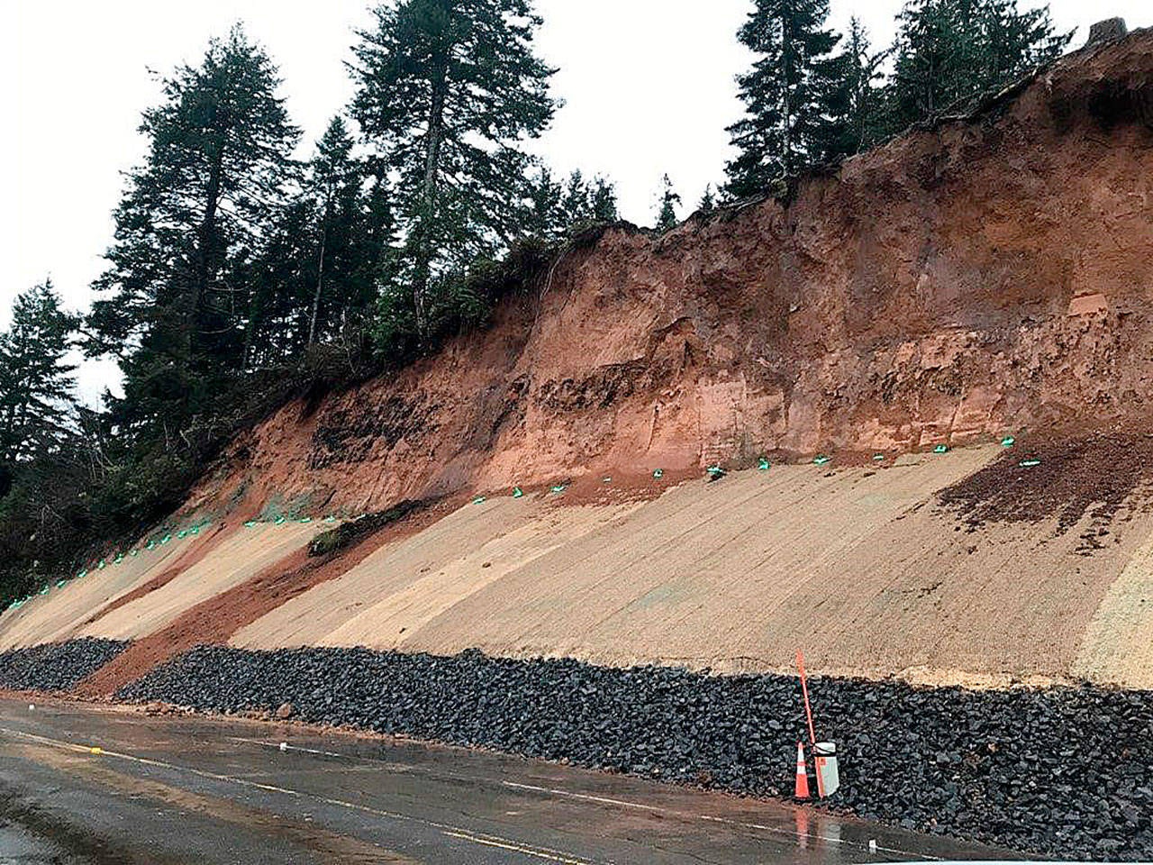 COURTESY STATE DEPARTMENT OF TRANSPORTATION 
A photo from Monday morning shows the dirt and debris that slid over the jute mat placed after the previous slide on State Route 109 just west of Hoquiam had been cleared.