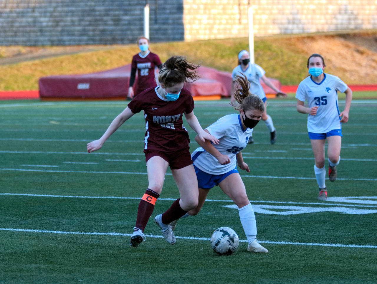 Montesano midfielder Brooke Streeter battles for possession against a La Center player during Wednesday’s 1A District 4 semifinal game in Montesano. (Ryan Sparks | The Daily World)