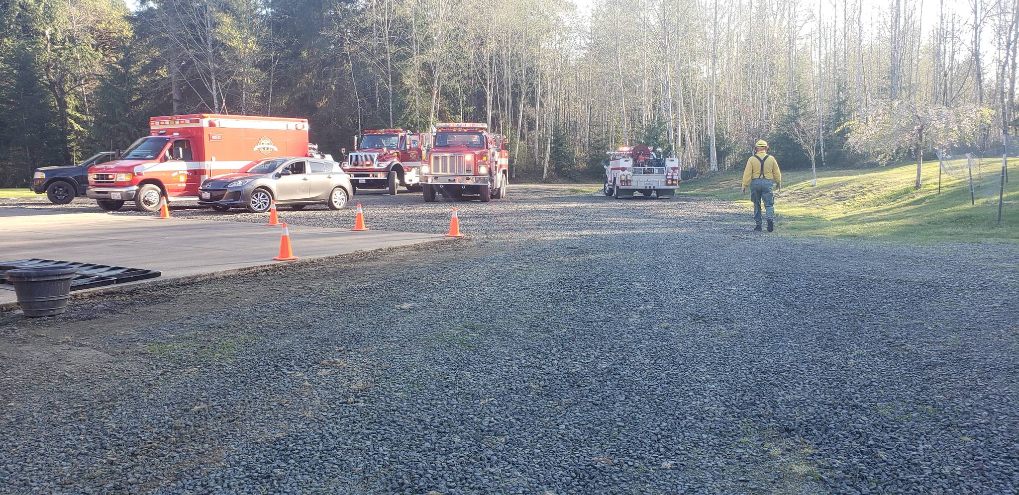 Vehicles from multiple agencies stage near the investigations. Photo by Brian Baldwin GHFD5 PIO