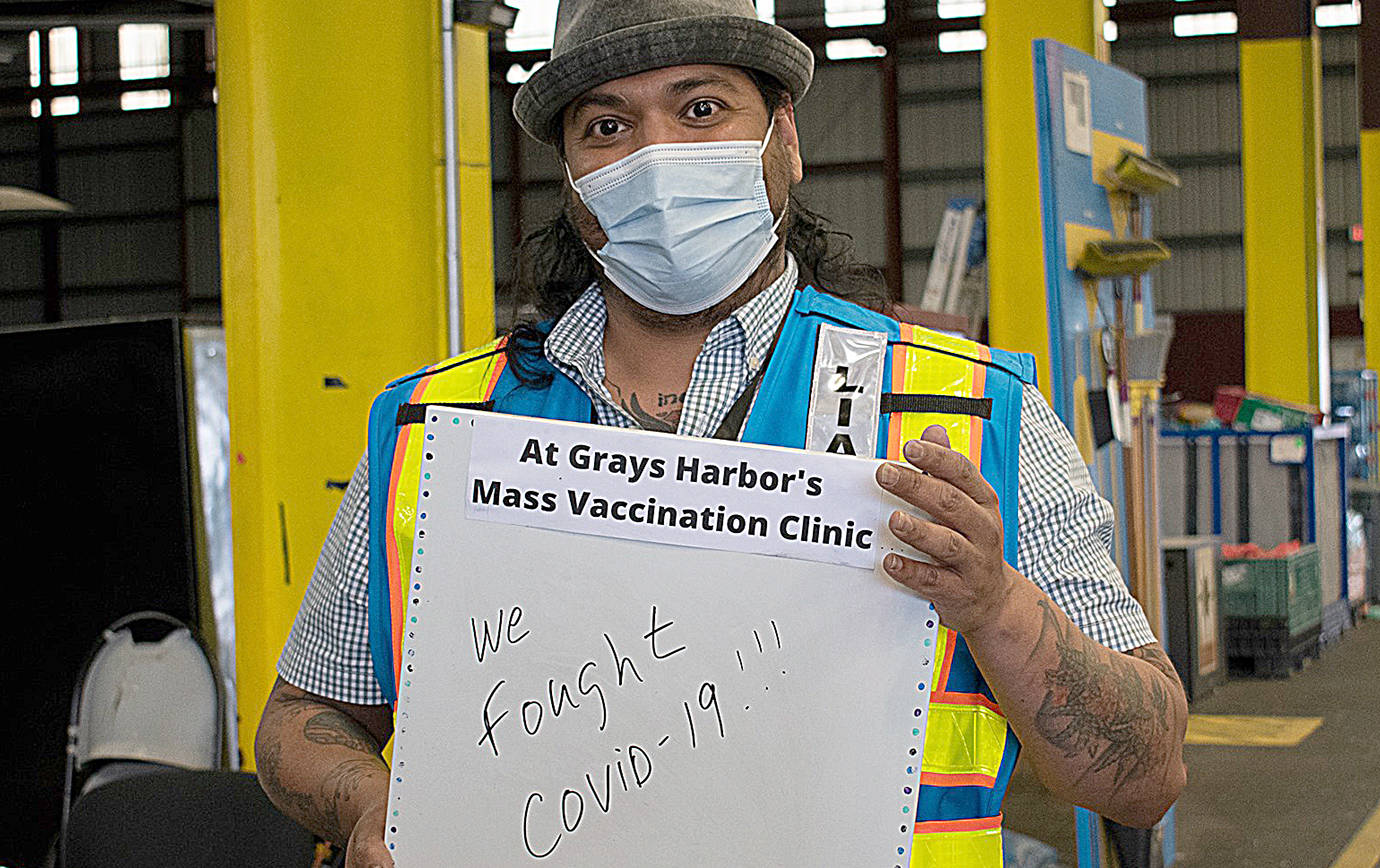 NIKKI GWIN PHOTO 
The last day of operations at the county’s mass vaccination site at the Port of Grays Harbor was Friday. Daniel Hannawalt-Morales, Grays Harbor Public Health Vaccine and Testing Branch Director, was among the group of volunteers and staff that reflected on the many hours dedicated to vaccinating as much of the county as possible.