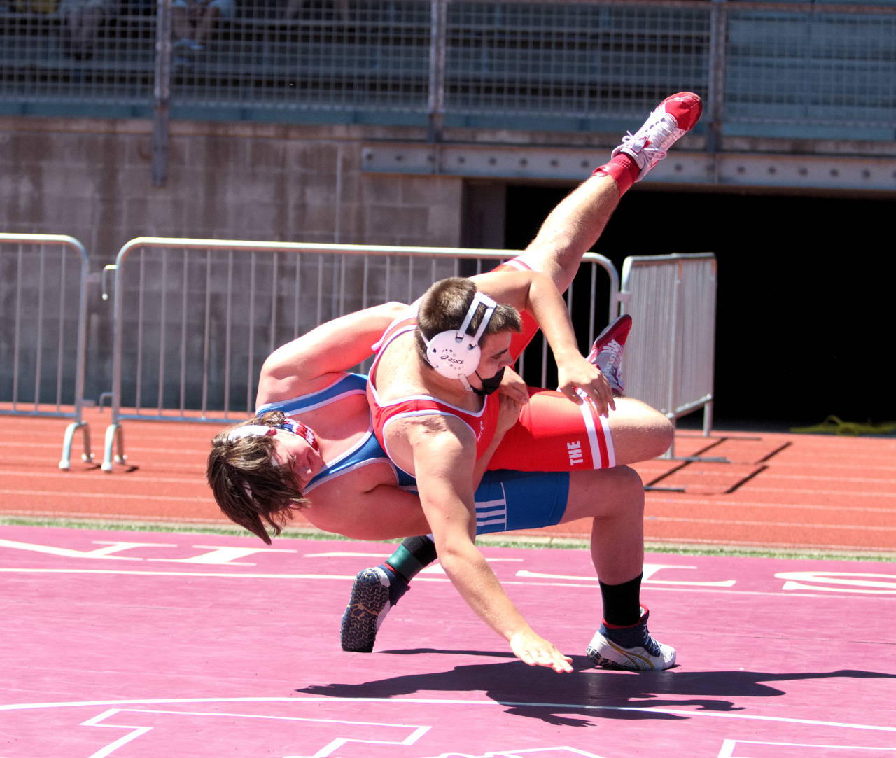 RYAN SPARKS | THE DAILY WORLD 
Elma’s Austin Salazar tosses Castle Rock’s Gage Cayan during a 220-pound semifinal match at the 1A District 4 Championships Saturday at Rottle Field in Montesano.