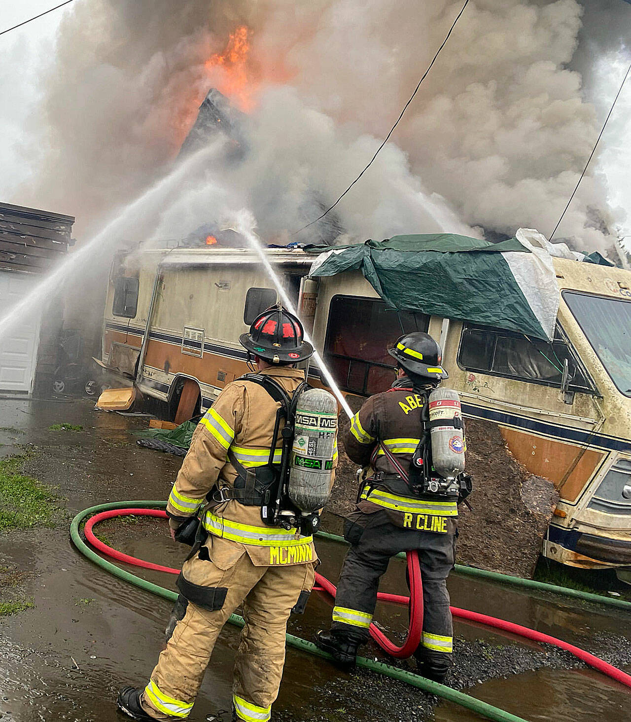 Aberdeen, Hoquiam and Fire District 2 personnel battled a fire on Grant Street in Aberdeen that had spread from an RV to an adjacent house Wednesday afternoon. (Courtesy Aberdeen Firefighters Local 2639)