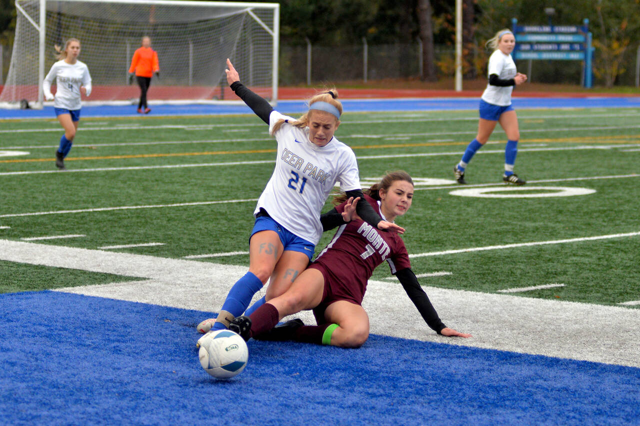 RYAN SPARKS | THE DAILY WORLD Montesano’s Jaiden Morrison (7) slide tackles the ball away from Deer Park’s Ella Carnahan during the Bulldogs’ 5-1 loss in the 1A State Girls Soccer Tournament semifinals on Friday at Shoreline Stadium in Shoreline.