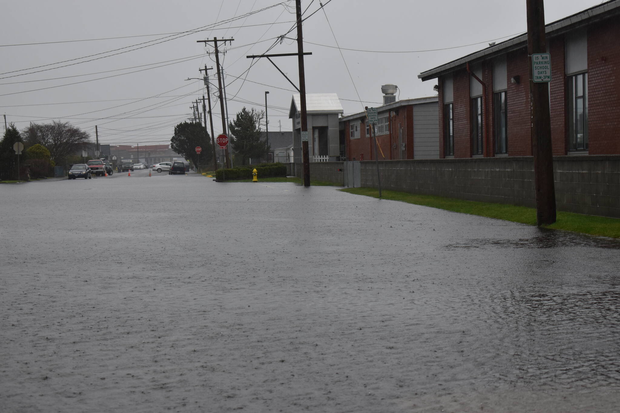 The rains Thursday, combined with a king tide measured at 10.4 feet, overwhelmed streets throughout Grays Harbor County, such as Bay Avenue’s stretch of road that runs in front of AJ West Elementary School in Aberdeen. (Matthew N. Wells | The Daily World)