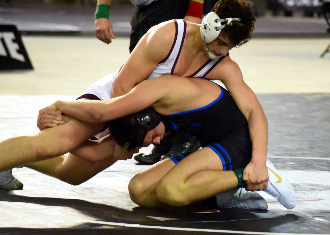 PHOTO BY SUE MICHALAK BUDSBERG Montesano’s Mateo Sanchez, top, wrestles Deer Park’s Bryon Newby in the 1A 182 pound state-championship match on Saturday at the Mat Classic XXXIII meet in Tacoma.