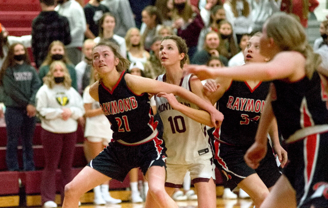 DAILY WORLD, FILE PHOTO 
Raymond’s Kyra Gardner (21) and Montesano’s Mikayla Stanfield (10) await a rebound during a game on Dec. 13, 2021. Both the Seagulls and Bulldogs will be competing in the WIAA State Tournament regional round on Saturday.