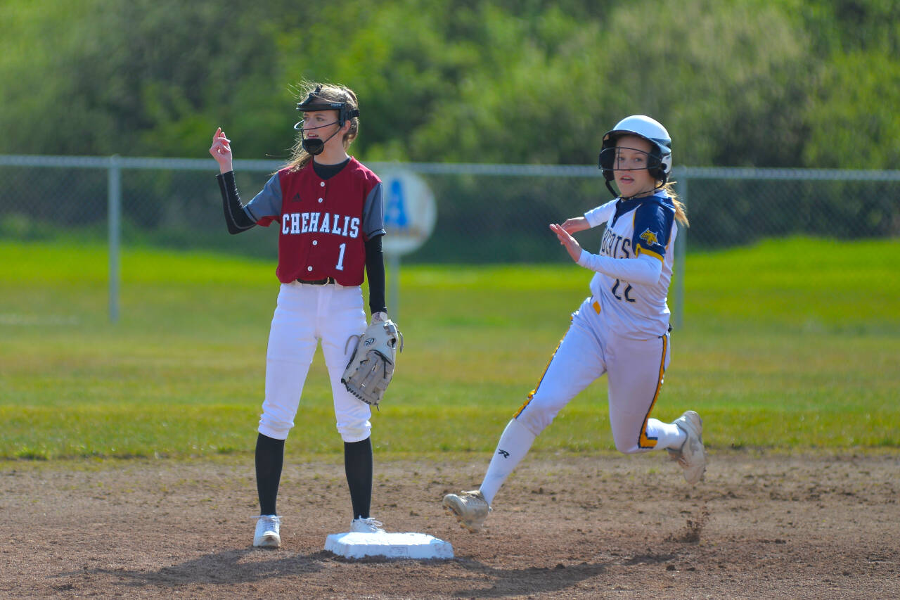 RYAN SPARKS | THE DAILY WORLD Aberdeen’s Aili Scott (22) rounds second base as WF West infielder Brielle Etter stands by during the first inning of the Bobcats’ 5-3 win on Wednesday in Aberdeen.