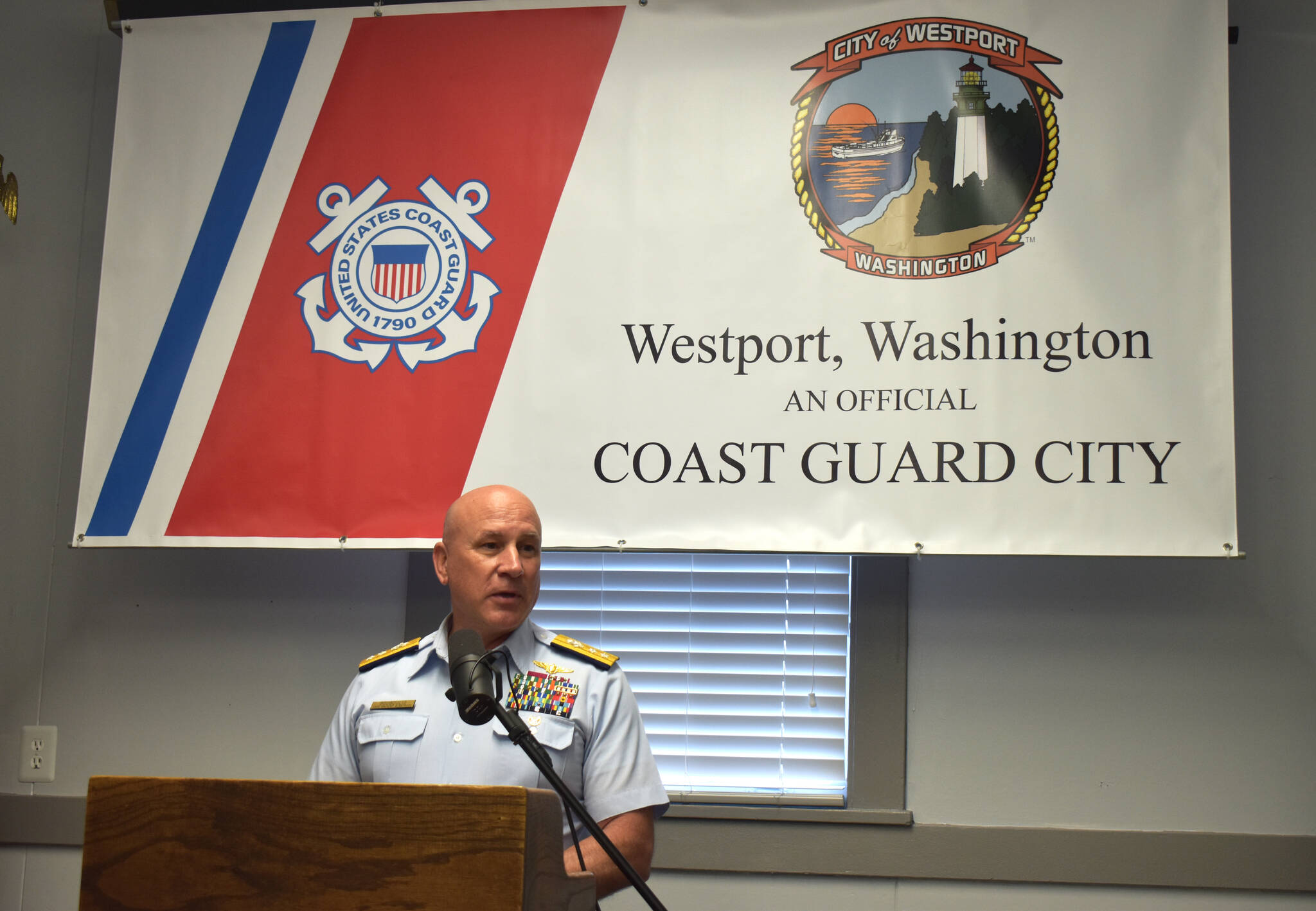 U.S. Coast Guard Rear Admiral Melvin W. Bouboulis, 13th District commander, speaks about the importance of the bond, and shared history, between the Coast Guard and the City of Westport on Saturday, May 28, 2022, at the city’s Coast Guard City Designation ceremony. The ceremony was held inside Westport Maritime Museum’s McCausland Hall. (Matthew N. Wells | The Daily World)