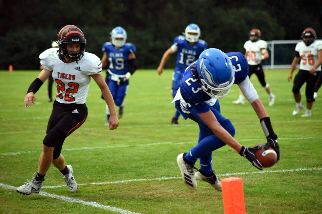 PHOTO BY SUE MICHALAK BUDSBERG Elma receiver Ethan Camus (23) dives into the end zone for a two-point conversion in the Eagles’ 20-7 win over Centralia on Friday at Davis Field in Elma.