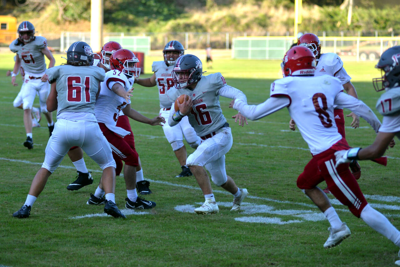 RYAN SPARKS | THE DAILY WORLD Hoquiam running back Jake Templer (16) runs through the Fort Vancouver defense during the Grizzlies’ 49-28 victory on Thursday in Hoquiam. Templer rushed for 110 yards and a touchdown.