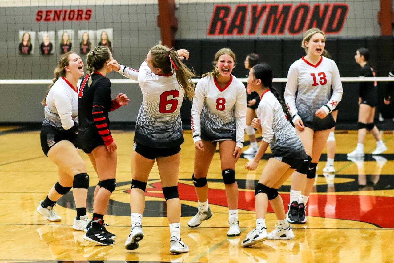 PHOTO BY LARRY BALE The Raymond Seagulls celebrate a point during a straight-set victory over Rainier on Thursday, Sept. 8, 2022 at Raymond High School.