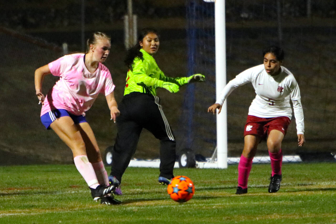 PHOTO BY BEN WINKELMAN Elma forward Miley Seaberg, left, is defended by Hoquiam’s Briana Herrera (5) during the Eagles’ 11-0 win on Thursday in Elma. Seaberg scored six goals in the game.