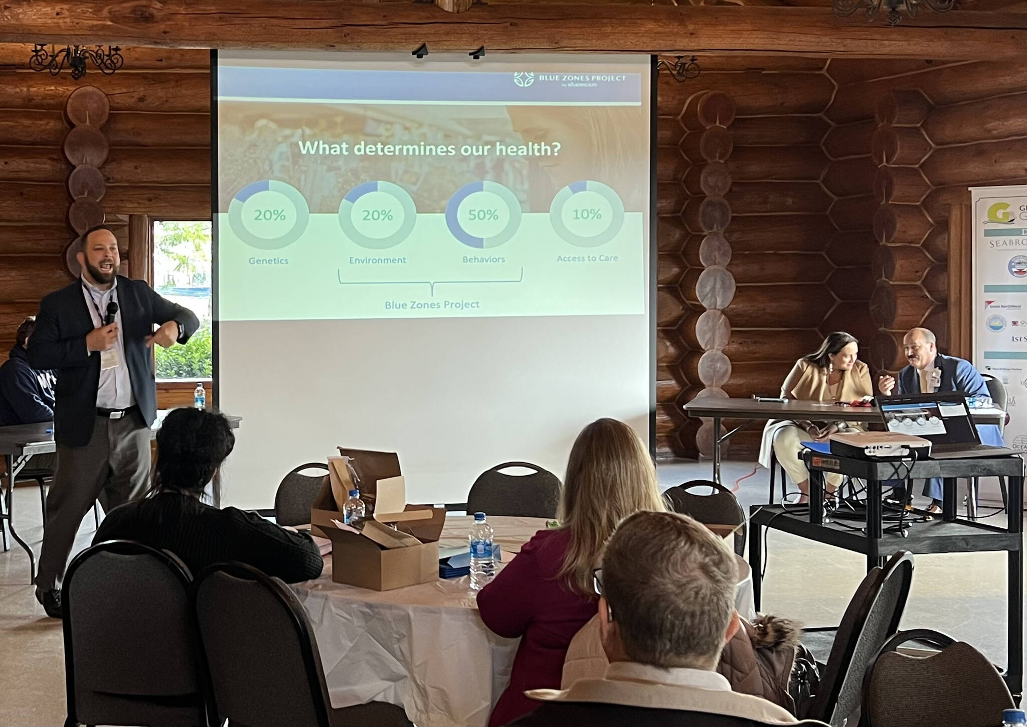 Clayton Franke / The Daily World 
Josh Martin, CEO of Summit Pacific Medical Center, left, presents to an audience of Grays Harbor business leaders and public officials at a luncheon hosted by Greater Grays Harbor at the Rotary Log Pavilion in Aberdeen Tuesday, Nov. 1.