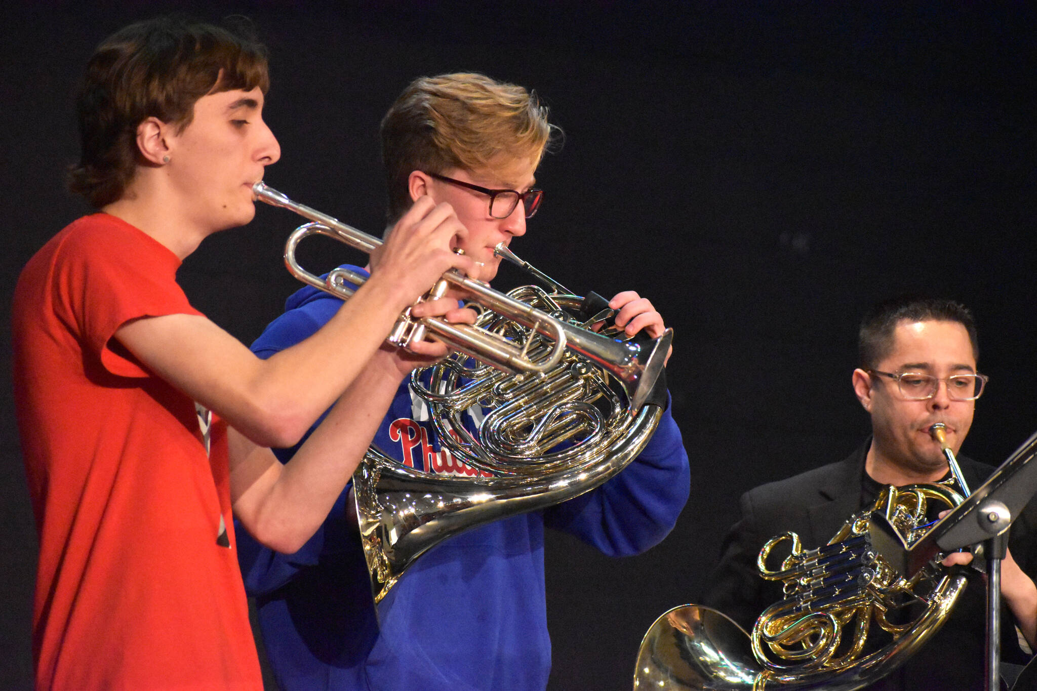 Matthew N. Wells / The Daily World
From left — Emmett Byron, a senior trumpet player, and Mick Bozich, a senior French horn player, both from Hoquiam High School, play alongside Juan Berrios, a trumpet player for the Dallas Brass band. The students, along with about 100 other students in the area attended an all-day music clinic on Wednesday at Hoquiam High School, where they learned various tricks of the trade.