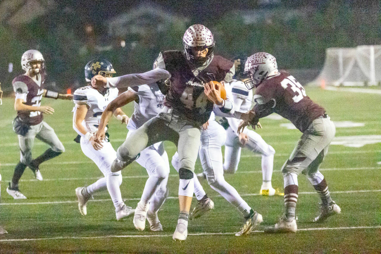 PHOTO BY TAYLOR MCELROY 
Montesano running back Gabe Bodwell (44) scores on an 8-yard run during the first half of the Bulldogs’ 47-7 win over Seton Catholic in a 1A district crossover game on Friday, Nov. 4, in Montesano.