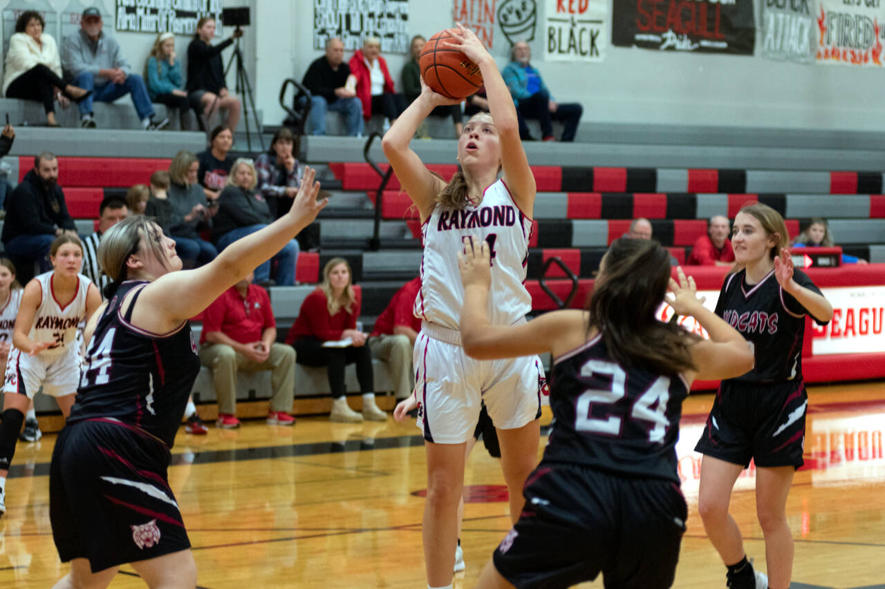 PHOTO BY VAN ADAM DAVIS Raymond’s Paige Williams (34) puts up a shot against Ocosta during a 71-9 victory on Wednesday at Raymond High School.