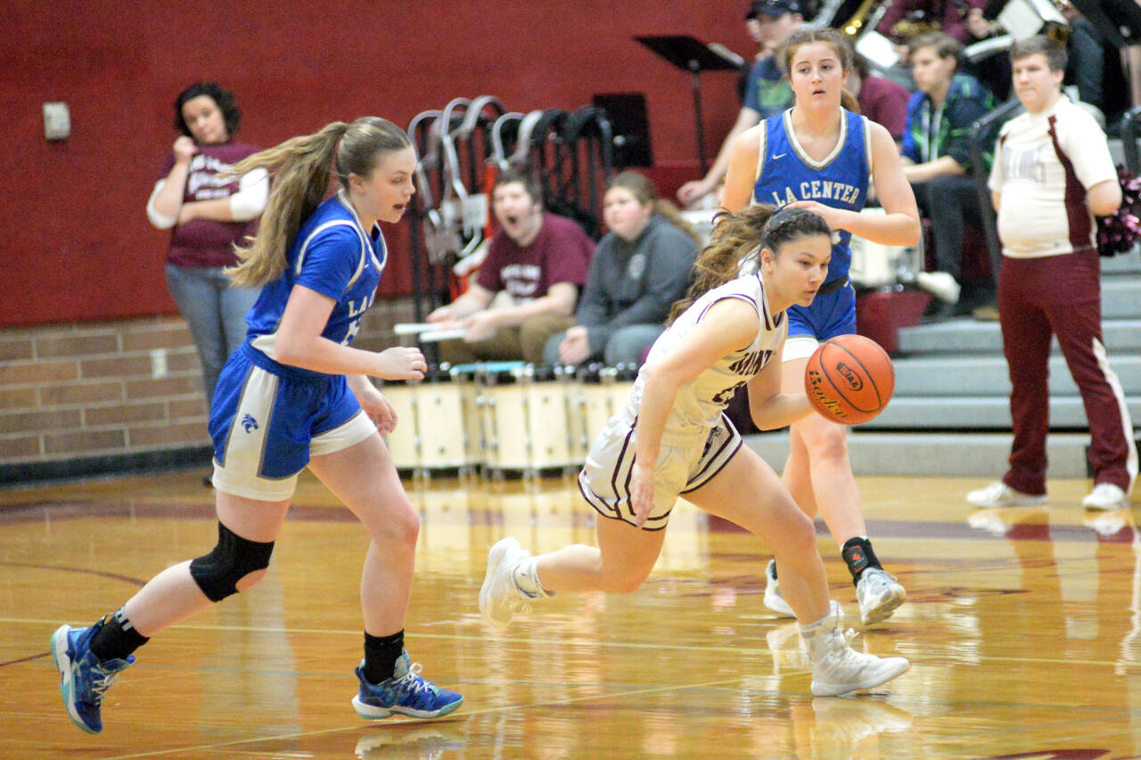 RYAN SPARKS | THE DAILY WORLD Montesano guard Vanna Prom, center, records one of her game-high eight steals during the Bulldogs’ 67-5 victory over La Center in the first round of the 1A District 4 Tournament on Thursday in Montesano.