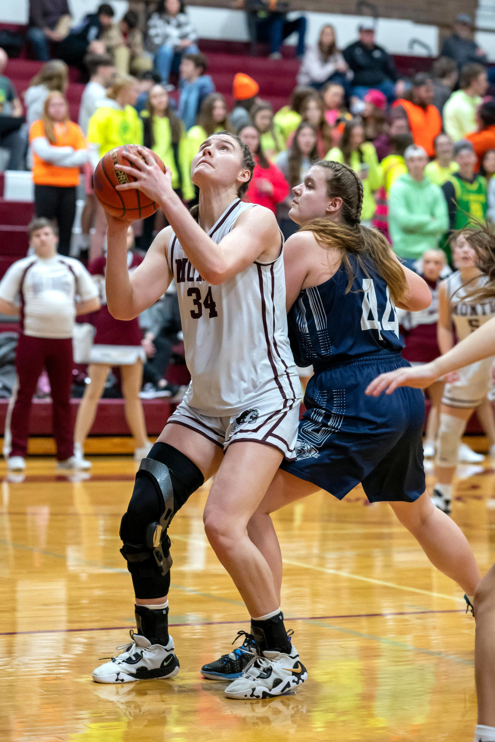 PHOTO BY FOREST WORGUM Montesano senior forward McKynnlie Dalan (34) looks to score against King’s Way Christian defender Izzy Hill during the Bulldogs’ 58-32 victory in a 1A District 4 semifinal game on Saturday in Montesano.