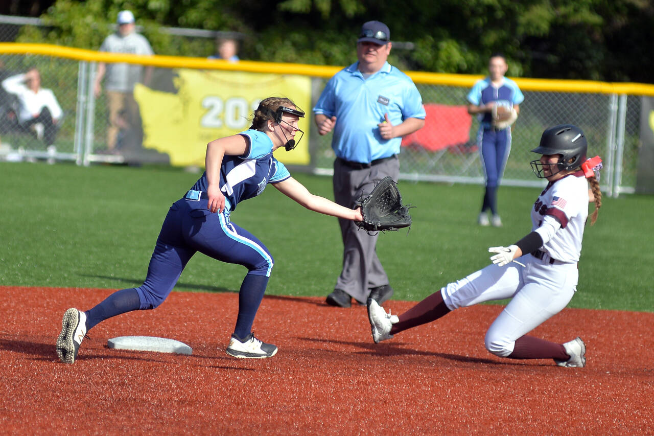 RYAN SPARKS | THE DAILY WORLD Montesano’s Addi Kersker, right, slides in safely to second base during a game against Hockinson on Saturday in Montesano.