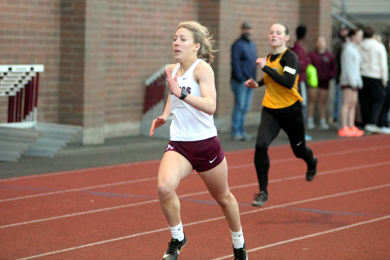 RYAN SPARKS | THE DAILY WORLD Montesano’s Lilly Causey, left, sprints down the back stretch ahead of North Beach’s Malia Cox to win the girls 200 meter race at the Ray Ryan Memorial Grays Harbor All-County Meet on Friday in Montesano.