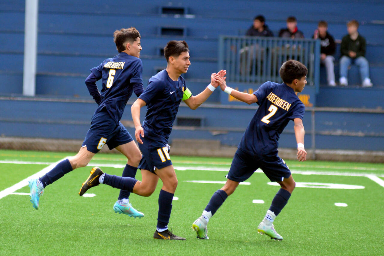 RYAN SPARKS | THE DAILY WORLD Aberdeen’s Edwin Quintana (10) is congratulated by teammate Hugo Garcia (2) after scoring a goal in the Bobcats’ 2-0 win over Hudson’s Bay in a 2A Evergreen District 4 Tournament game on Saturday in Aberdeen.