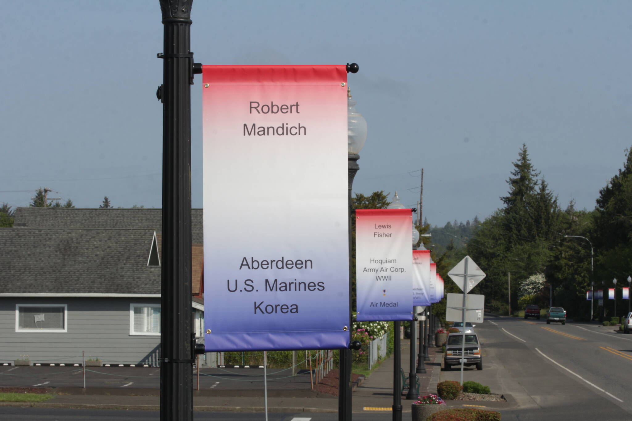 Memorial banners line the main street of Cosmopolis, the fruit of a years-long effort by a local veteran to collect the names of the war dead from the county. (Michael S. Lockett / The Daily World)