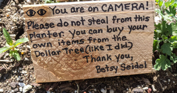 Provided photo
The wooden sign Betsy Seidel, of Hoquiam Crime Watch, left near a flower box that got vandalized at the city line between Aberdeen and Hoquiam. Seidel doesn’t want people to get discouraged since 99% of people seem to appreciate the flowers.