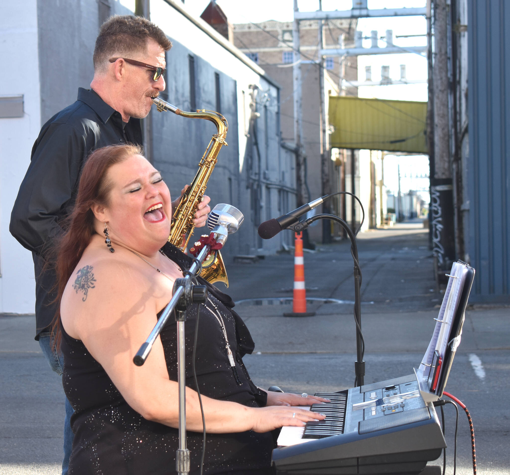 Matthew N. Wells / The Daily World
Tiffany Maki bellows during one of the classic tunes her group, Ms. Maki and Co., played Saturday. Brad McNeill, on tenor saxophone, is known as “Brad Saxxy.” It’s this kind of chemistry — nicknames and inside jokes — that allows a band to stay tight.