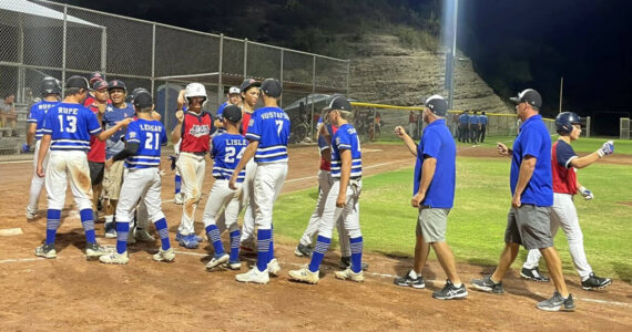 PHOTO COURTESY OF ELMA LITTLE LEAGUE The Elma Intermediate all-stars (blue) shake hands with Oregon after a 6-3 win to open the Little League West Regional on Friday in Nogales, Arizona.