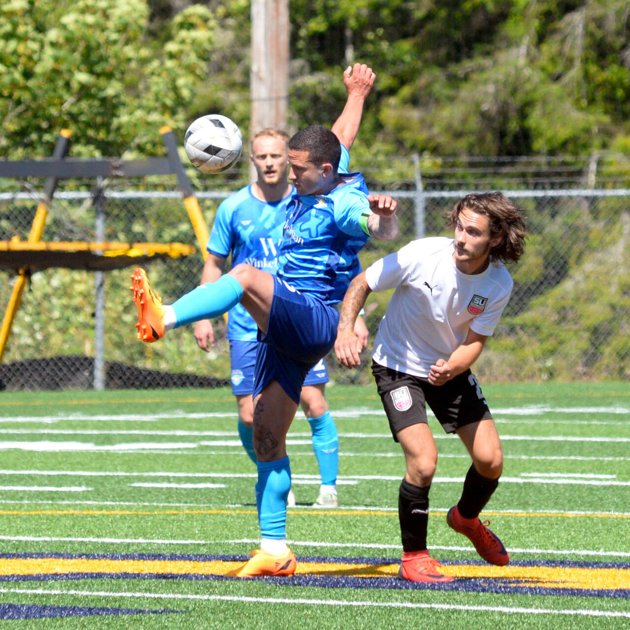 RYAN SPARKS | THE DAILY WORLD Grays Harbor Gulls midfielder Aaron Arias, left, makes a play while being defended by Steel United FC’s Micah Armstrong during a 4-1 loss on Sunday in Aberdeen.