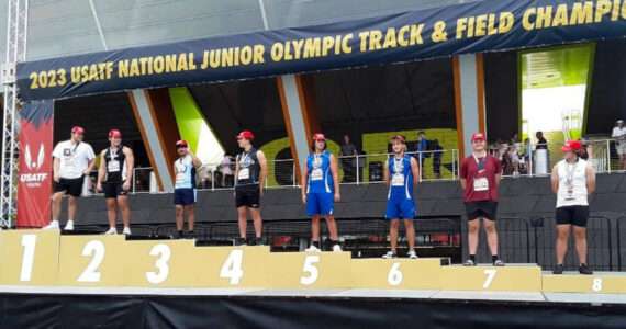 SUBMITTED PHOTO Aberdeen’s Tyler Bates (7) stands on the podium after placing seventh in the 17-18 year-old hammer throw at the USA Track & Field National Junior Olympic Championships on Monday, July 24 at Hayward Field on the University of Oregon campus in Eugene, Oregon.