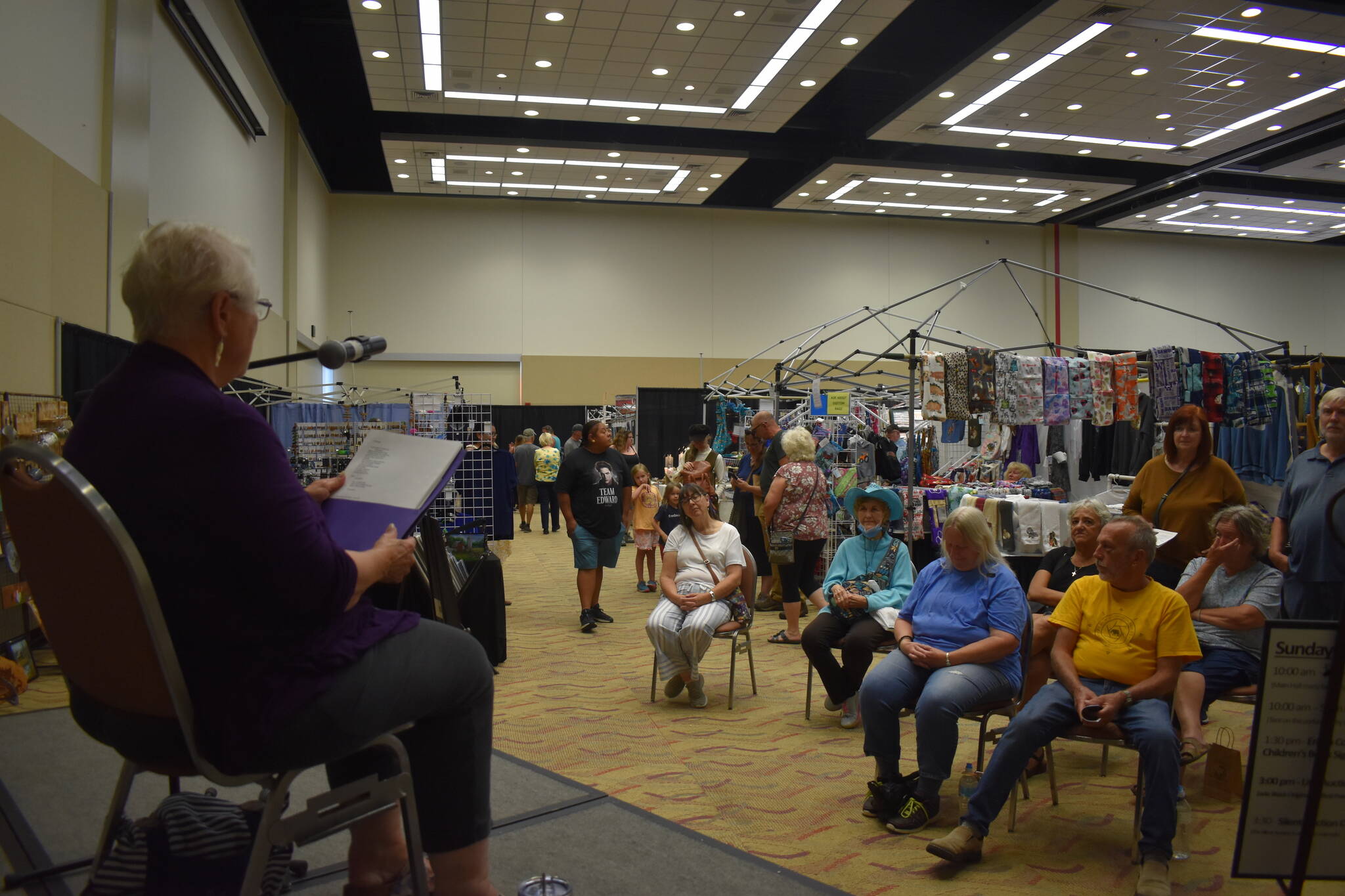 Sandy McCulloch, whose life has taken her from California to Alaska, shares a variety of poetry in front of an attentive audience at the 54th annual Associated Arts Ocean Shores Arts & Crafts Festival. McCulloch called it "an honor," for her to be asked to share her work. McCulloch loved being at the festival. "It's absolutely fabulous and very upscale," McCulloch said. (Matthew N. Wells / The Daily World)